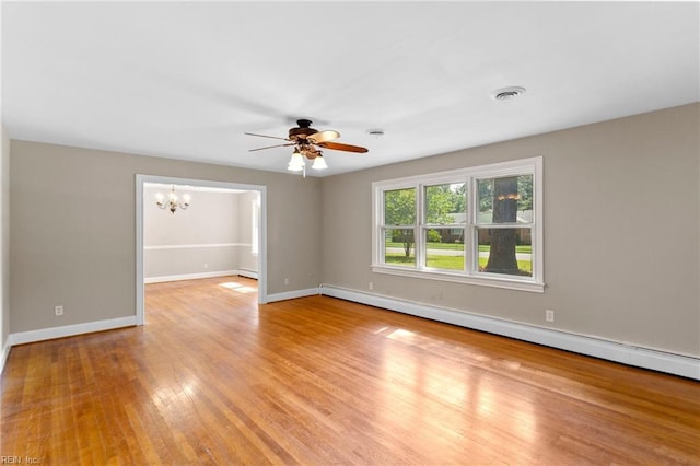 416 N Broad St, Suffolk, VA 23434 - unfurnished room with baseboard heating, ceiling fan, a baseboard heating unit, light wood-style flooring, and a chandelier