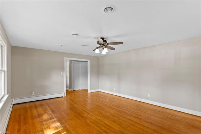 416 N Broad St, Suffolk, VA 23434 - spare room with baseboard heating, ceiling fan, and wood finished floors