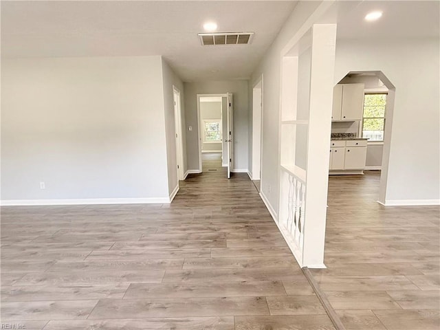 200 W Ocean Ave, Norfolk, VA 23503 - hallway featuring light wood-type flooring, arched walkways, and recessed lighting