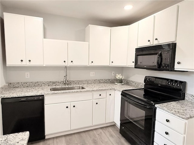 200 W Ocean Ave, Norfolk, VA 23503 - kitchen featuring black appliances, light wood-type flooring, white cabinets, and recessed lighting