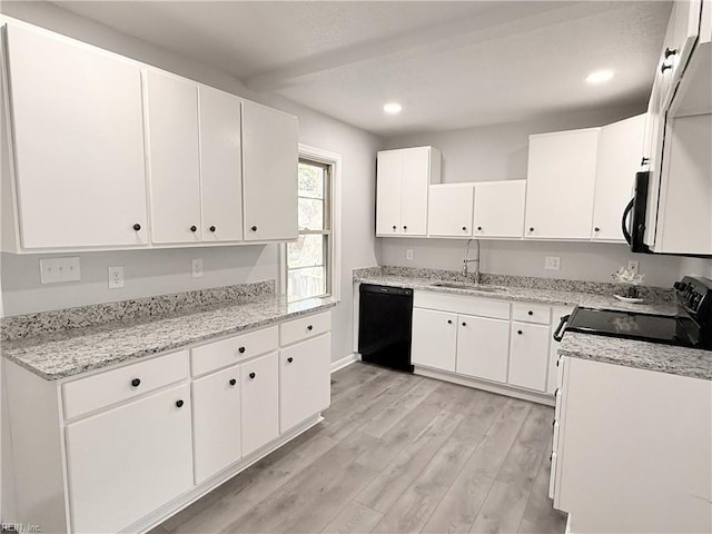 200 W Ocean Ave, Norfolk, VA 23503 - kitchen with black appliances, white cabinets, recessed lighting, light wood finished floors, and light stone counters