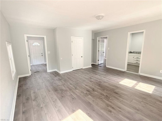 200 W Ocean Ave, Norfolk, VA 23503 - unfurnished living room featuring wood finished floors and baseboards