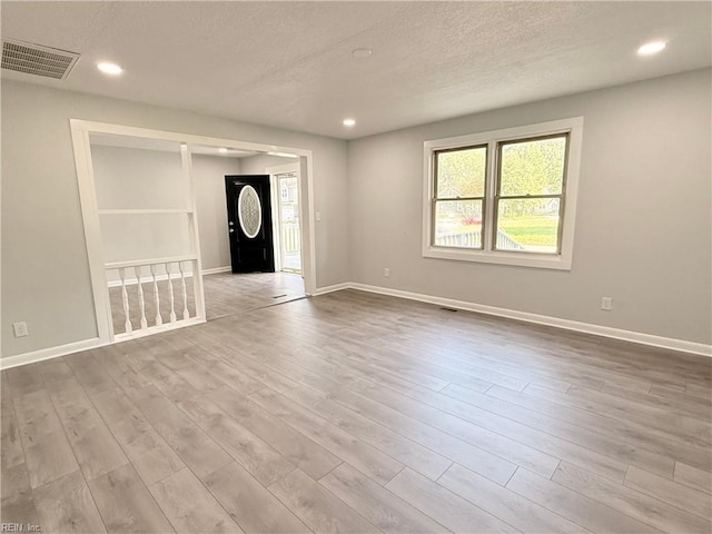 200 W Ocean Ave, Norfolk, VA 23503 - spare room with a textured ceiling, wood finished floors, and recessed lighting