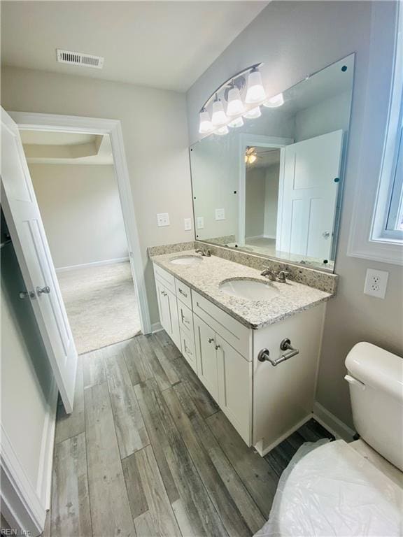 1400 Winslow Ave, Chesapeake, VA 23323 - bathroom with wood finished floors, double vanity, and a ceiling fan