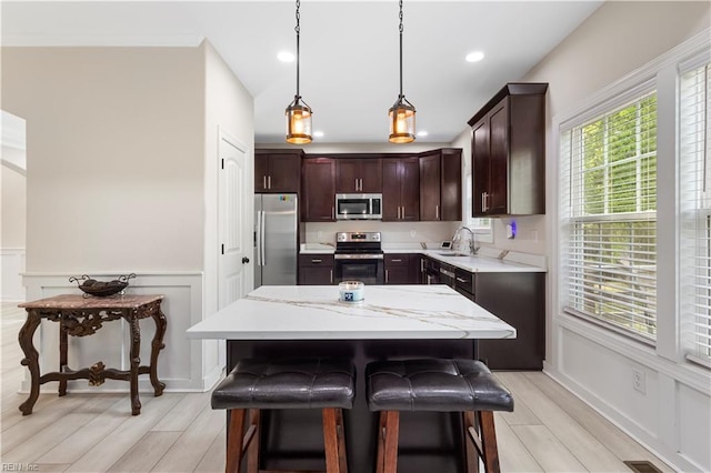 316 A Pocahontas Ave, Franklin, VA 23851 - kitchen featuring stainless steel appliances, dark brown cabinetry, decorative light fixtures, wainscoting, and recessed lighting