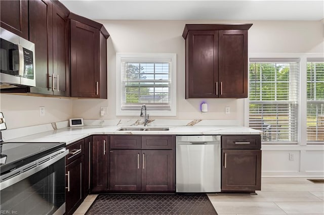 316 A Pocahontas Ave, Franklin, VA 23851 - kitchen with appliances with stainless steel finishes, light stone counters, and dark brown cabinetry