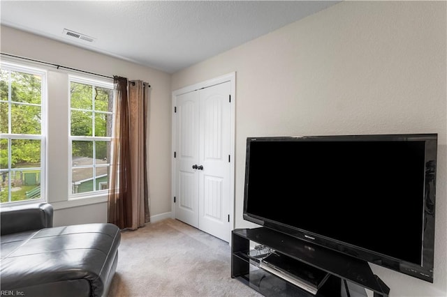 316 A Pocahontas Ave, Franklin, VA 23851 - sitting room with light colored carpet and baseboards