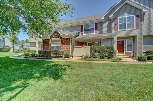 3856 Lasalle Dr Unit 107, Virginia Beach, VA 23453 - view of front of home with brick siding, a front lawn, and a gate