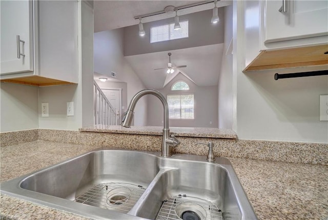 3856 Lasalle Dr Unit 107, Virginia Beach, VA 23453 - kitchen view of a ceiling fan, white cabinetry, and light stone counters