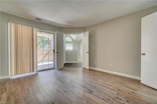 3856 Lasalle Dr Unit 107, Virginia Beach, VA 23453 - spare room featuring wood finished floors and a textured ceiling