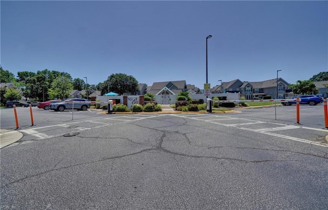 3856 Lasalle Dr Unit 107, Virginia Beach, VA 23453 - view of asphalt street featuring street lighting, a residential view, sidewalks, and curbs