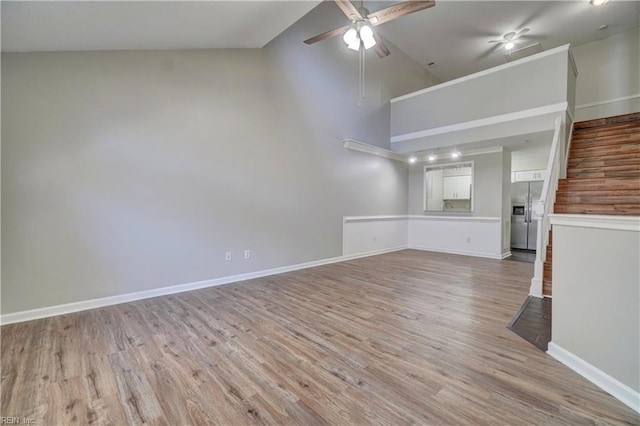 3856 Lasalle Dr Unit 107, Virginia Beach, VA 23453 - unfurnished living room featuring a ceiling fan, high vaulted ceiling, and light wood-style floors