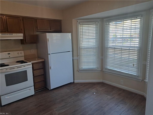 812 Liberal Arts Ct, Virginia Beach, VA 23462 - kitchen with white appliances, under cabinet range hood, wood finished floors, brown cabinets, and light countertops