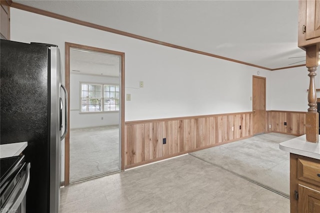 2024 Sarahs Cove Dr, Hayes, VA 23072 - unfurnished dining area featuring light colored carpet, a wainscoted wall, ornamental molding, and wooden walls
