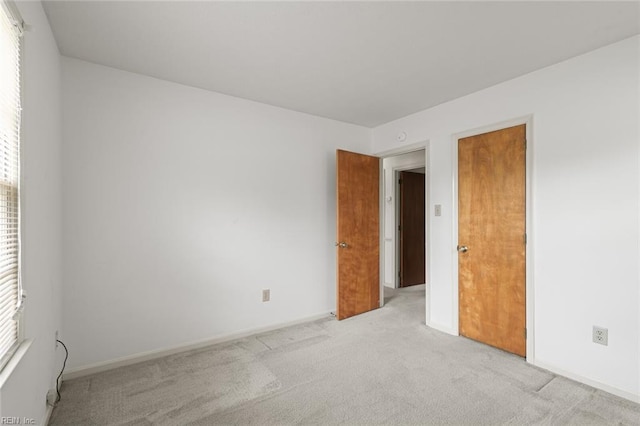2024 Sarahs Cove Dr, Hayes, VA 23072 - unfurnished room with light carpet and baseboards