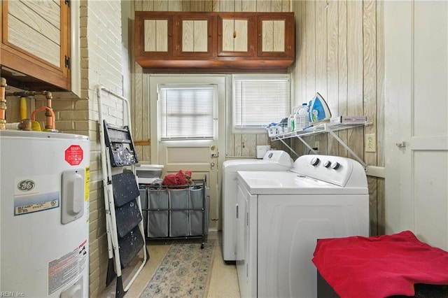 139 Chancellor Rd, Hampton, VA 23661 - laundry room with electric water heater, independent washer and dryer, cabinet space, and wood walls