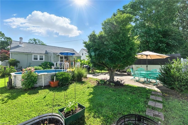 139 Chancellor Rd, Hampton, VA 23661 - view of green lawn with a garden and a patio