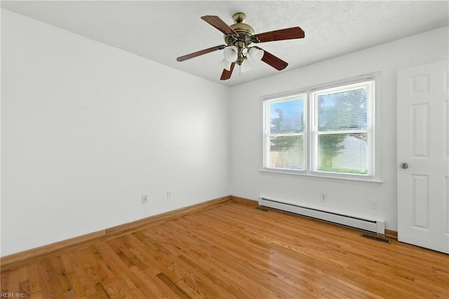 10 Watts Dr, Hampton, VA 23666 - unfurnished room featuring a baseboard heating unit, light wood-type flooring, and ceiling fan