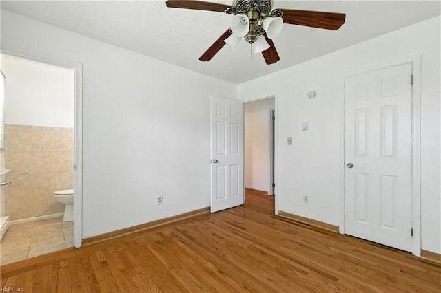 10 Watts Dr, Hampton, VA 23666 - unfurnished bedroom with light wood-style floors, connected bathroom, and ceiling fan