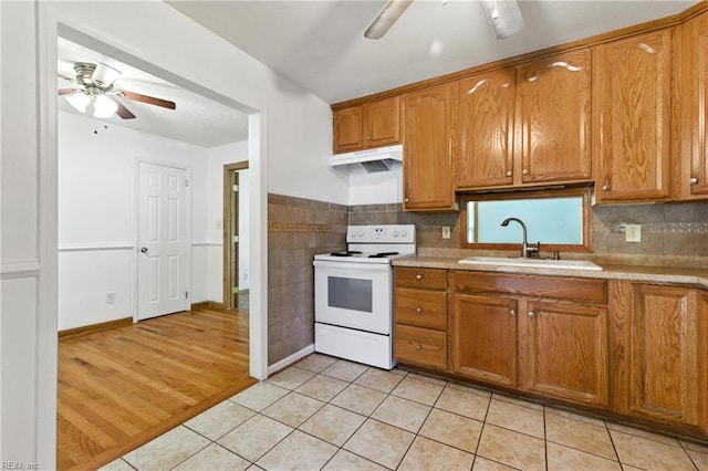10 Watts Dr, Hampton, VA 23666 - kitchen with white range with electric cooktop, a ceiling fan, under cabinet range hood, light countertops, and light tile patterned floors