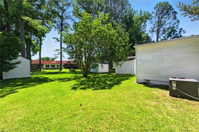 10 Watts Dr, Hampton, VA 23666 - view of grassy yard featuring a storage shed