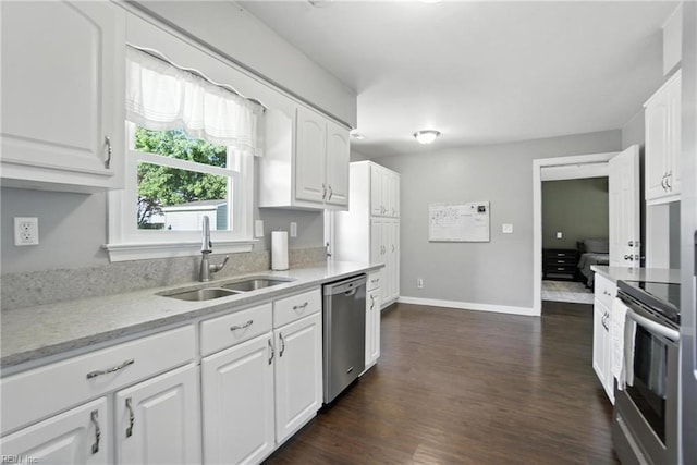 1245 Bells Mill Rd, Chesapeake, VA 23322 - kitchen featuring appliances with stainless steel finishes, white cabinetry, and dark wood-style flooring