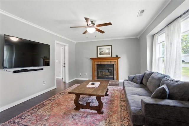 1245 Bells Mill Rd, Chesapeake, VA 23322 - living room with a ceiling fan, dark wood-style flooring, crown molding, and a tile fireplace