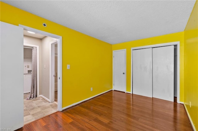 5012 Thatcher Way, Virginia Beach, VA 23456 - unfurnished bedroom with wood finished floors and a textured ceiling