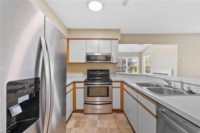 5012 Thatcher Way, Virginia Beach, VA 23456 - kitchen featuring appliances with stainless steel finishes, light countertops, and white cabinetry