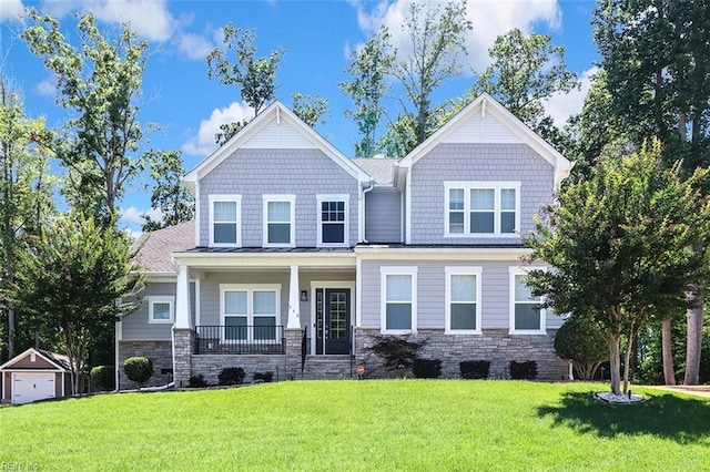113 Saint Andrews, Smithfield, VA 23430 - craftsman-style house with covered porch, a front yard, stone siding, and an outdoor structure