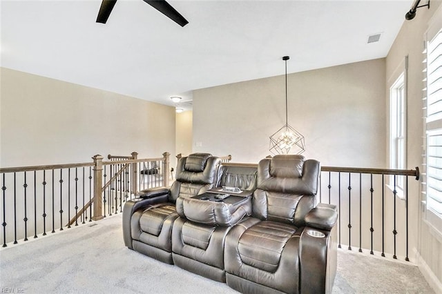 113 Saint Andrews, Smithfield, VA 23430 - carpeted cinema room with healthy amount of natural light, a chandelier, and a ceiling fan
