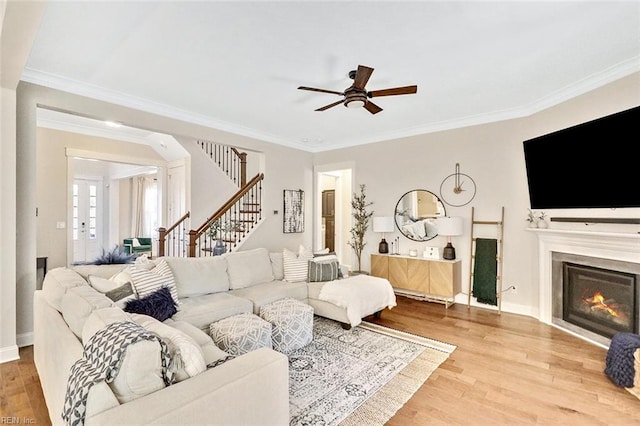 113 Saint Andrews, Smithfield, VA 23430 - living room with a ceiling fan, stairway, wood finished floors, crown molding, and a glass covered fireplace