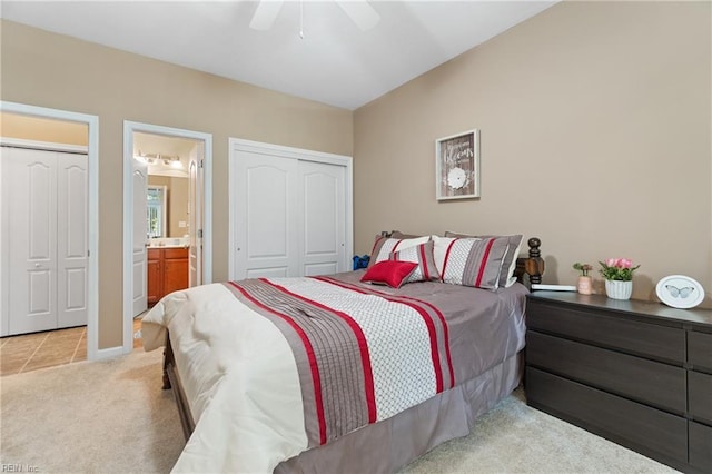 507 Marsh Hawk Trl, Carrollton, VA 23314 - bedroom with light carpet, ensuite bathroom, ceiling fan, and light tile patterned floors