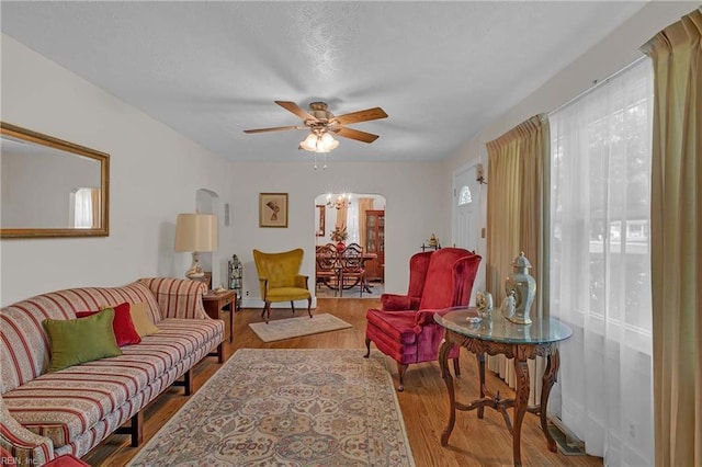 8579 Farys Mill Rd, Gloucester, VA 23061 - living area with plenty of natural light, wood finished floors, a ceiling fan, and a chandelier