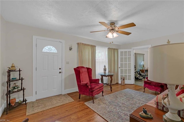 8579 Farys Mill Rd, Gloucester, VA 23061 - living area with ceiling fan, wood finished floors, a textured ceiling, and french doors