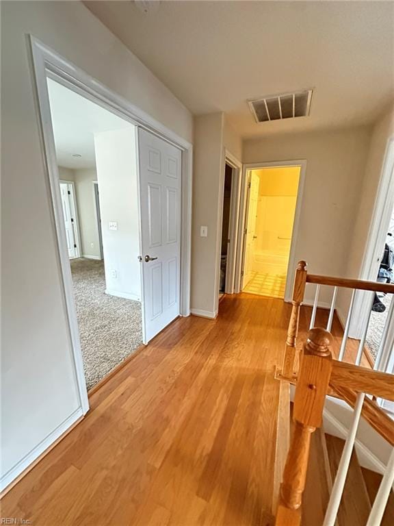 5837 Flowering Peach Ln, Providence Forge, VA 23140 - hallway with an upstairs landing and light wood-style floors