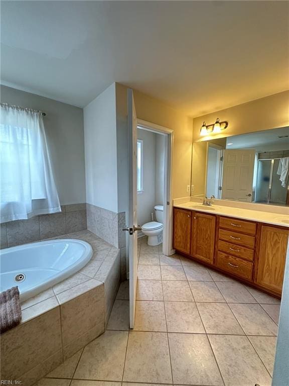 5837 Flowering Peach Ln, Providence Forge, VA 23140 - full bathroom featuring a garden tub, double vanity, tile patterned floors, and a stall shower