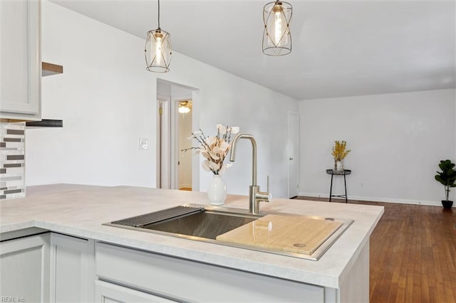2734 Jamestown Ave, Hampton, VA 23661 - kitchen featuring light countertops, dark wood-type flooring, and decorative light fixtures
