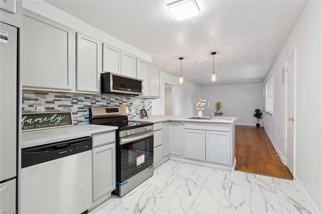 2734 Jamestown Ave, Hampton, VA 23661 - kitchen with stainless steel appliances, a peninsula, light countertops, backsplash, and light marble finish flooring