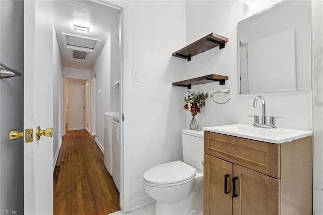 2734 Jamestown Ave, Hampton, VA 23661 - bathroom with vanity, washing machine and dryer, and wood finished floors