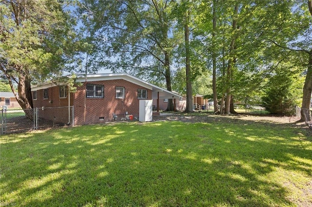 2734 Jamestown Ave, Hampton, VA 23661 - back of house with crawl space, a fenced backyard, and brick siding