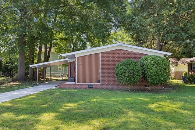 2734 Jamestown Ave, Hampton, VA 23661 - view of property exterior with driveway, crawl space, a carport, and brick siding
