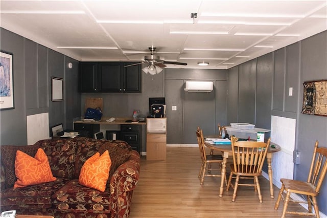 3728 Sidley Rd, Chesapeake, VA 23321 - kitchen with light wood-style flooring, a ceiling fan, a wall unit AC, and dark cabinets