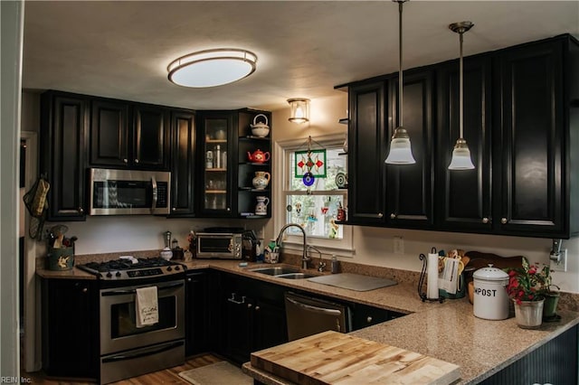 3728 Sidley Rd, Chesapeake, VA 23321 - kitchen with stainless steel appliances, dark cabinets, wooden counters, and decorative light fixtures