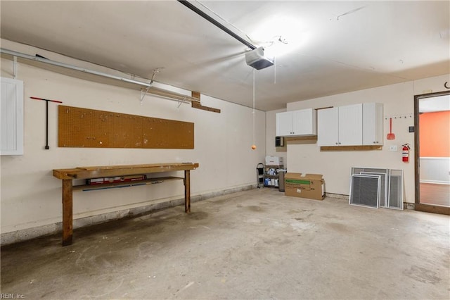 1444 Debbs Ln, Chesapeake, VA 23320 - garage with a garage door opener and a workshop area