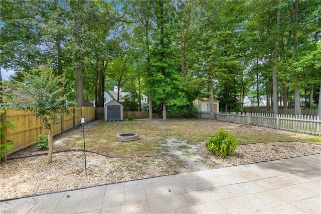 1444 Debbs Ln, Chesapeake, VA 23320 - fenced backyard featuring a shed and a fire pit