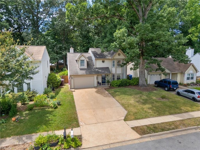 1444 Debbs Ln, Chesapeake, VA 23320 - traditional home featuring a front lawn, concrete driveway, a chimney, an attached garage, and roof with shingles