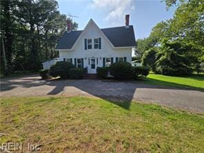 1697 Old Ferry Rd, Hudgins, VA 23076 - view of front facade with a front lawn and a chimney