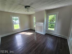 1697 Old Ferry Rd, Hudgins, VA 23076 - unfurnished living room featuring plenty of natural light, a ceiling fan, and dark wood-style flooring
