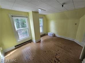 1697 Old Ferry Rd, Hudgins, VA 23076 - bonus room featuring healthy amount of natural light, hardwood / wood-style flooring, and a baseboard radiator